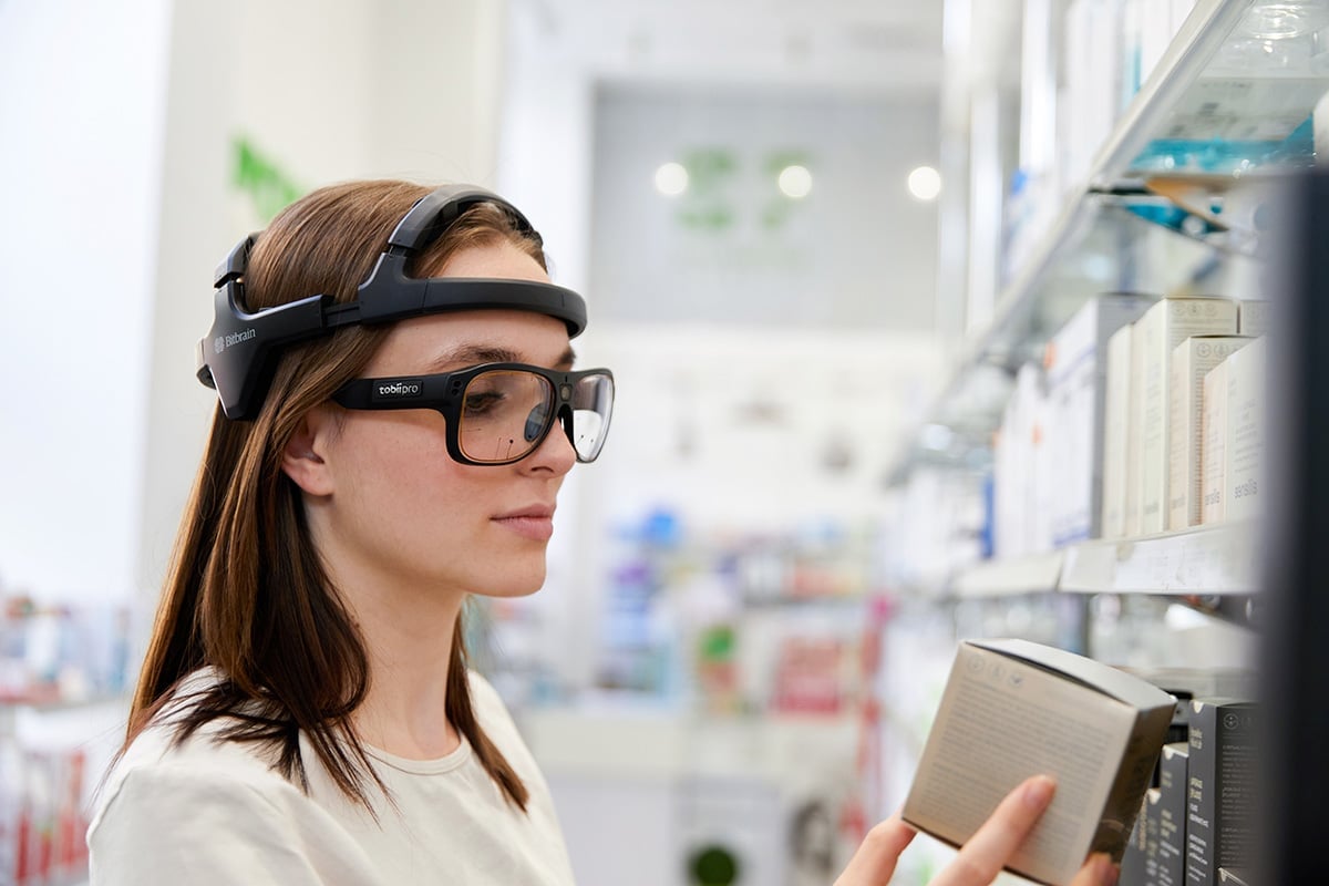 Participant wearing Tobii Glasses 3 and Bitbrain Diadem, in a point sale study